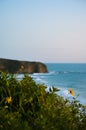 Point break against a cliffside