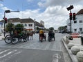 Point 0 KM Yogyakarta. There's a horse-drawn carriage and a pedicab stopping in the traffic light Royalty Free Stock Photo