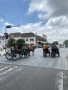 Point 0 KM Yogyakarta. There's a horse-drawn carriage and a pedicab stopping in the traffic light Royalty Free Stock Photo