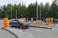 Point of passing cars to airport parking. Auto drives up to slag-boom and payment terminal Royalty Free Stock Photo