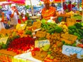 Point-a-Pitre, Guadeloupe - February 09, 2013: woman sells fresh fruits at the outdoor market in Guadeloupe.