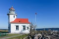 Point Robinson Lighthouse against blue sky in sunshine on Puget Sound Royalty Free Stock Photo