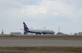 The point of tangency. The Boeing 737-800 (VQ-BVP) Aeroflot landing at Sheremetyevo airport Royalty Free Stock Photo