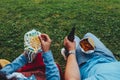 point of view couple outdoors eating popcorn drinking beer no faces Royalty Free Stock Photo