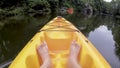 Point of view of feet in a kayak