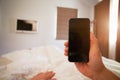 Point Of View Image Of Person In Bed Looking At Mobile Phone