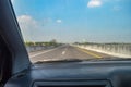 point of view from inside a car traveling at high speed on a toll road Royalty Free Stock Photo