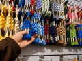 Point of view of man buying multicolored thread for macrame