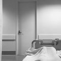 Point of view of the patient in the hospital bed. Monochrome photo.