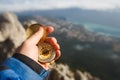 Point of view photo of explorer man searching direction with golden compass in his hand above clouds with autumn Royalty Free Stock Photo