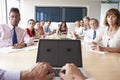 Point Of View Shot Of Businesspeople Around Boardroom Table Royalty Free Stock Photo