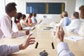 Point Of View Shot Of Businesspeople Around Boardroom Table Royalty Free Stock Photo