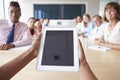 Point Of View Shot Of Businesspeople Around Boardroom Table Royalty Free Stock Photo