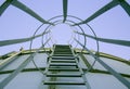Point of view shot of metal stairs leading up a water tank Royalty Free Stock Photo