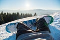 Snowboarder resting in the mountains Royalty Free Stock Photo