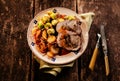 Point of view of stuffed pork dish on table