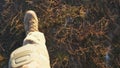 Point of view to female feet of ukrainian soldiery going in brown boots through dry grass at countryside. Legs of young