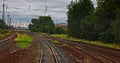 Point of view train travel under cloudy sky