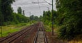 Point of view train travel under cloudy sky