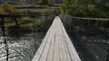 POV video of walking through old shaky suspension bridge