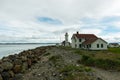 The Point Wilson Lighthouse and the Keeper`s House in Fort Worden State Park, Port Townsend, Washington, USA Royalty Free Stock Photo