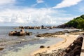 Pointe Cocos coastline with granite rocks sticking out from the ocean, Praslin Island, Seychelles