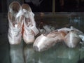 Pointe shoes - female ballet shoes, an integral part of female dance in classical ballet. The dancer takes a position with a Royalty Free Stock Photo