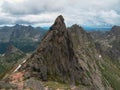 Pointed cliff, a misty mountainside. Ghost rocks. Awesome scenic mountain landscape with big cracked pointed stones closeup in