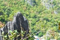 Pointed tip of a rock formation at the top of a cliff