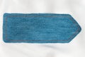 Pointer made of denim fabric with yellow stitching on white silk Royalty Free Stock Photo