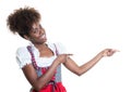 Pointing african american woman with bavarian oktoberfest dress