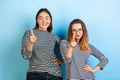 Young emotional women on gradient blue background