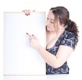 Pointing fat girl with blank sign, billboard Royalty Free Stock Photo