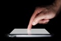 Pointing finger on a digital tablet