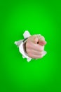 Pointing hand through hole Royalty Free Stock Photo
