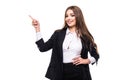 Pointing and looking to the side. Casual young business woman looking, pointing and smiling at copy space. Royalty Free Stock Photo