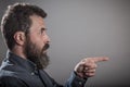 Pointing to side, Huge beard portrait, mature adult Caucasian ma Royalty Free Stock Photo