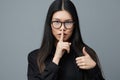 Pointing woman fashion asian studio finger smile portrait background student beautiful business cute glasses Royalty Free Stock Photo