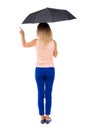 Pointing woman under an umbrella Royalty Free Stock Photo