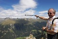 Pointing at wonderful landscape in the Alps Royalty Free Stock Photo