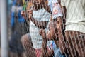 POINTNOIRE/CONGO - 18MAY2013 - African children behind iron net