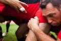 POINTNOIRE/CONGO - 18MAY2013 - Expressive portrait of rugby player playing with friends.