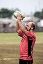 POINTNOIRE/CONGO - 18MAY2013 - man playing rugby with friends