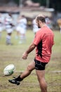 POINTNOIRE/CONGO - 18MAY2013 - man playing rugby with friends