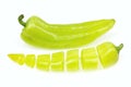 Pointy green pepper and one cut into pieces