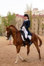 Poised equestrian in formal attire during outdoor training