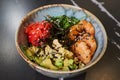 A poke bowl with Chuka Wakame seaweed, wasabi, avocado, cashew, nori, shrimps