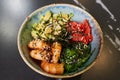 A poke bowl with Chuka Wakame seaweed, wasabi, avocado, cashew, nori, shrimps