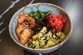 A poke bowl with Chuka Wakame seaweed, wasabi, avocado, cashew, nori, shrimps