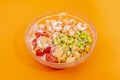 Poke bowl with edamame, cherry tomatoes, cooked peeled prawns, fried corn and sauce